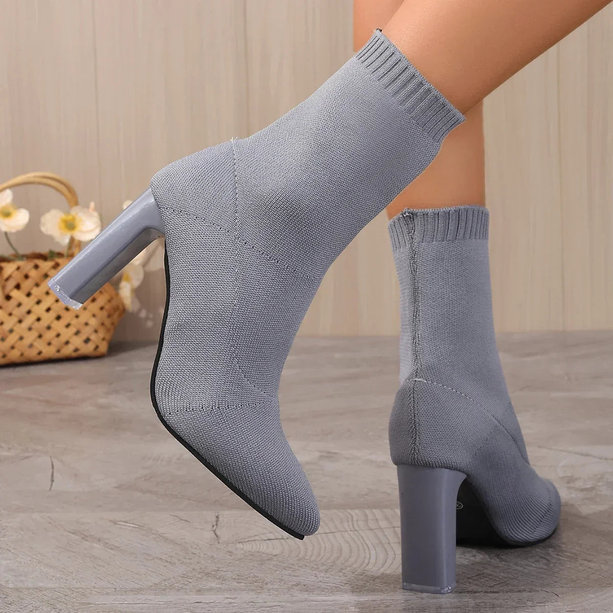 Pale blue knit sock boot with stretch ankle fit, slip-on style for women