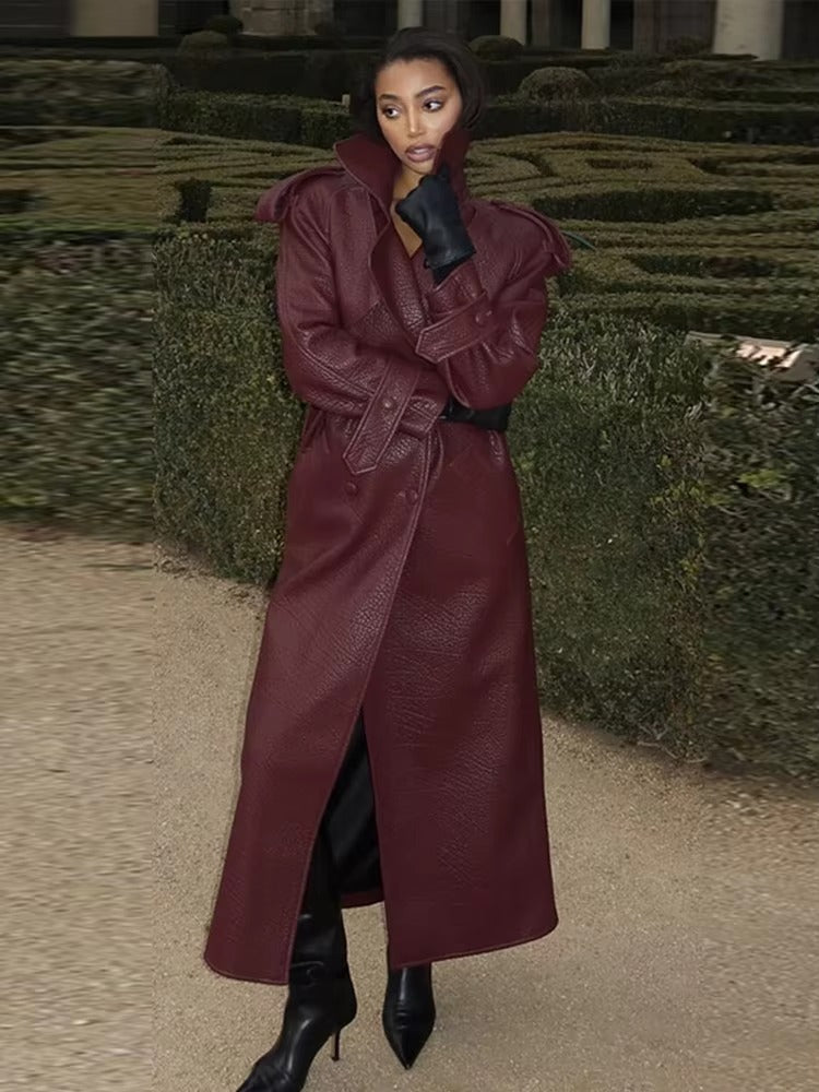 Women's black long trench leather coat sleek structured silhouette with extended coverage for professionals