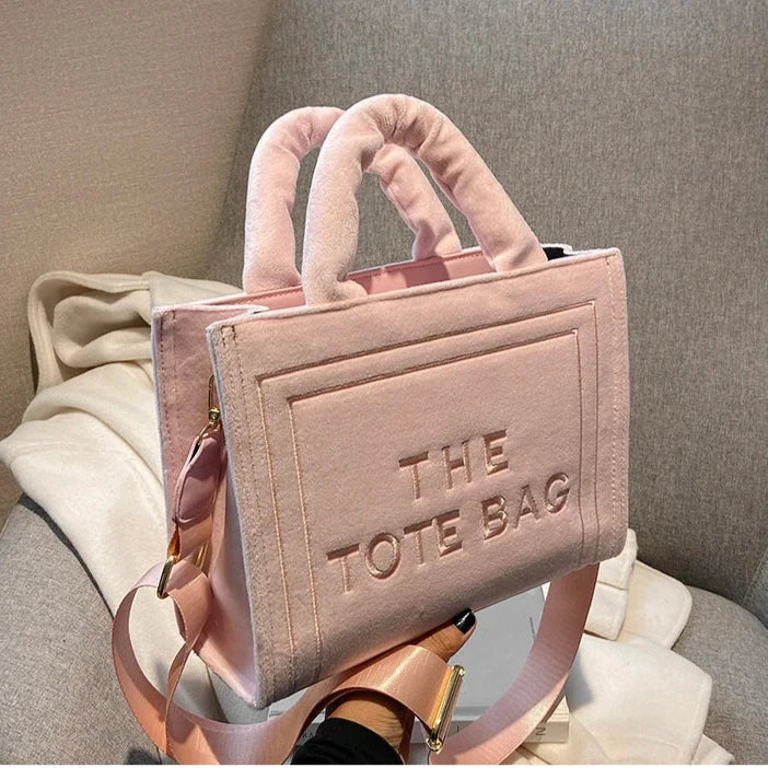 Urbann-Vibe velour tote bag with signature letter print, spacious interior, plush texture, modern square silhouette