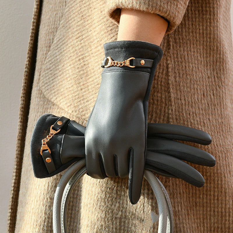 Women's black leather wrist-length gloves with gold chain accent, fitted silhouette for elegant style