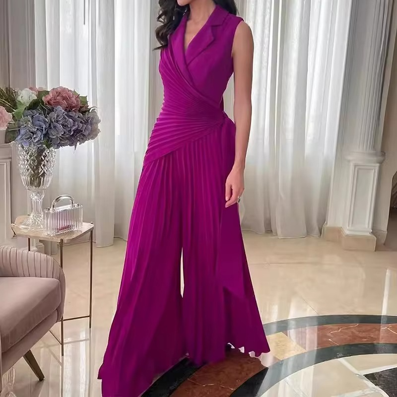 Ivory sleeveless wide-leg romper with lapel collar, high waist, and pleated professional silhouette