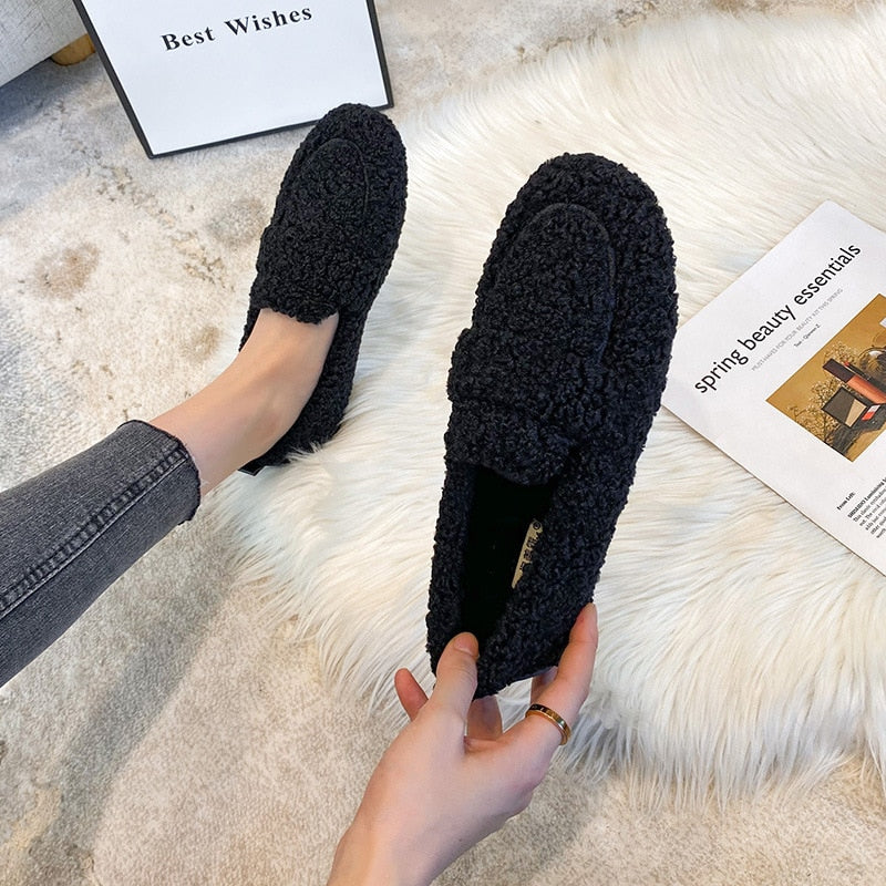 Women's plush moccasin slippers with non-slip sole, cozy cloudlike lining, elegant home comfort style