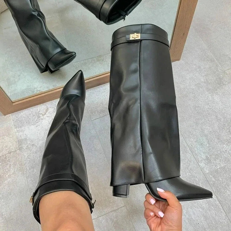 Women's black leather thigh-high boots with bold buckle detail for elegant city style
