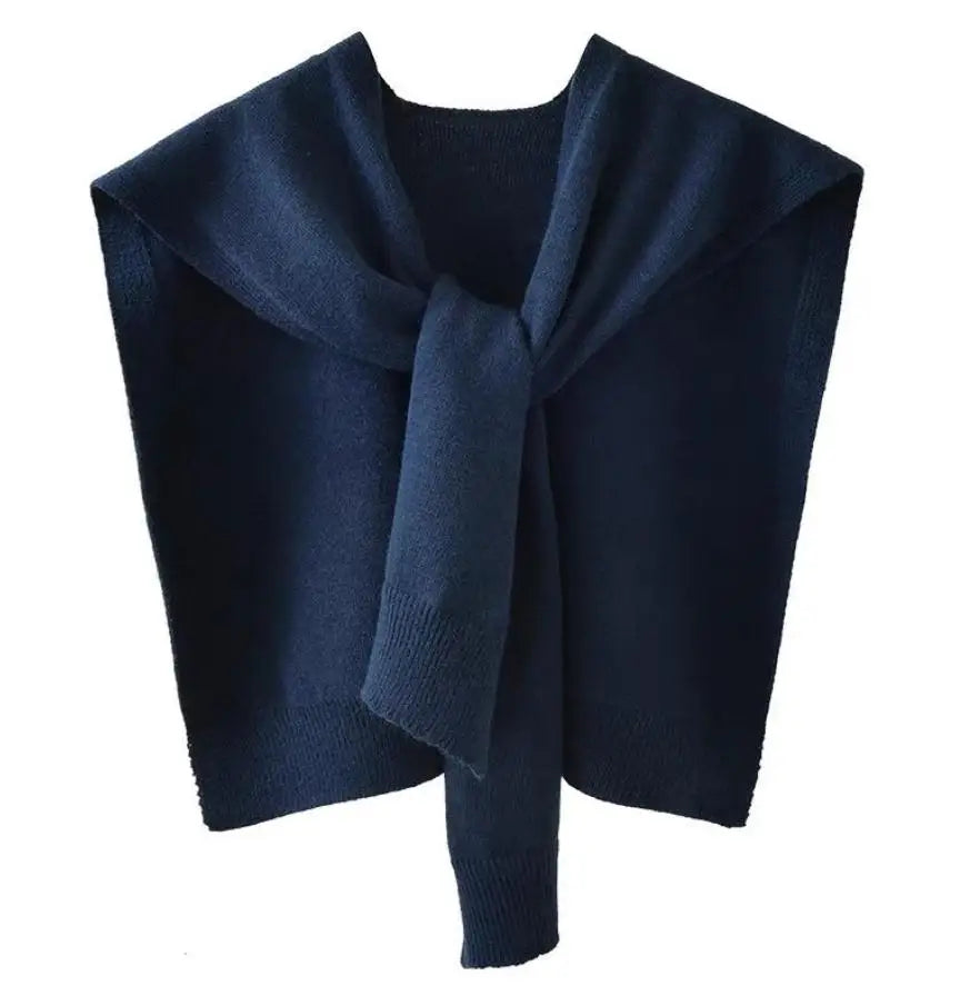 Women's knitted scarf wrap in cozy sweater-inspired texture with ribbed hem for versatile layering