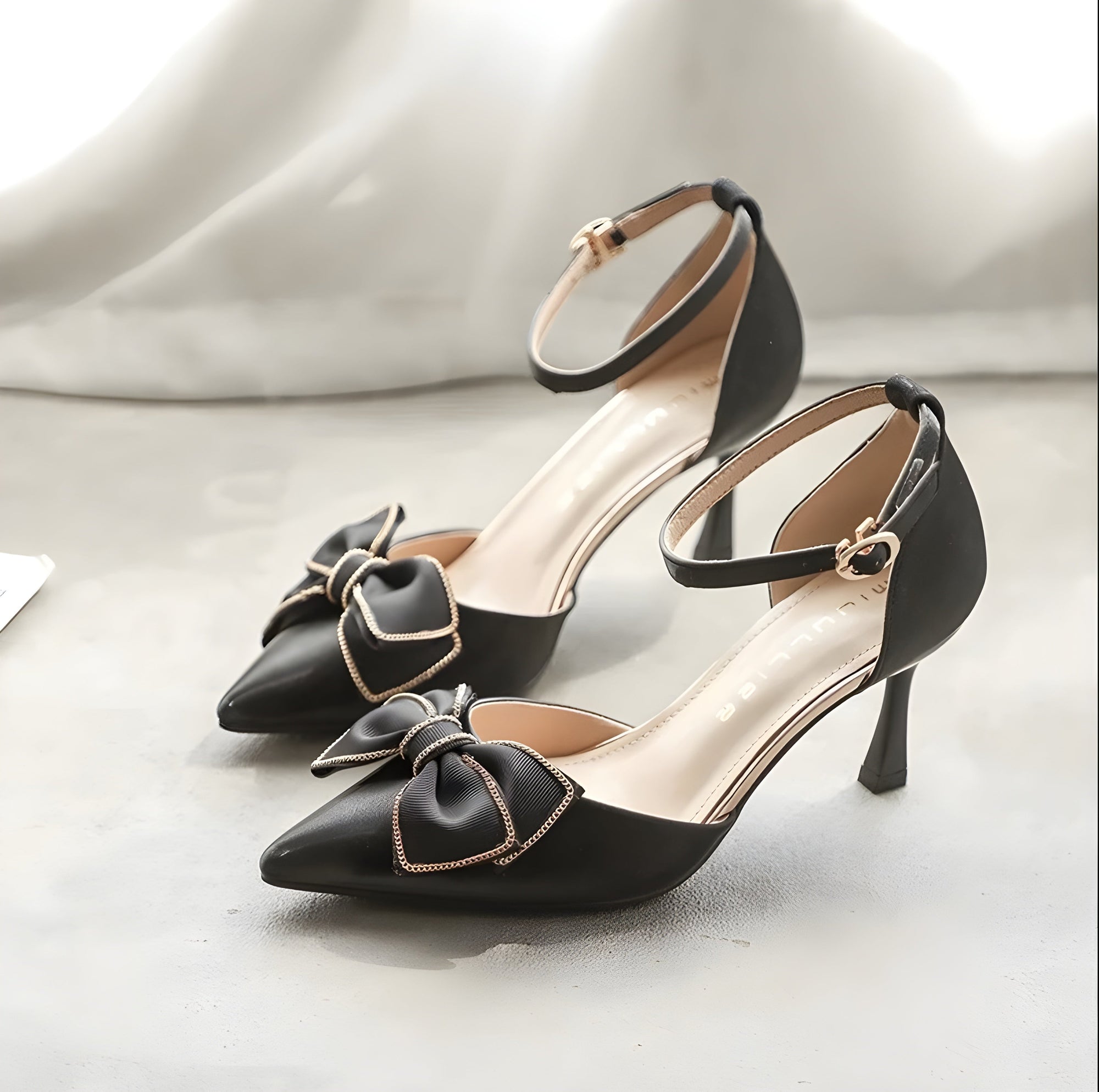Pearlescent vegan leather mid-heel pumps with delicate bow accent, balanced heel for everyday wear