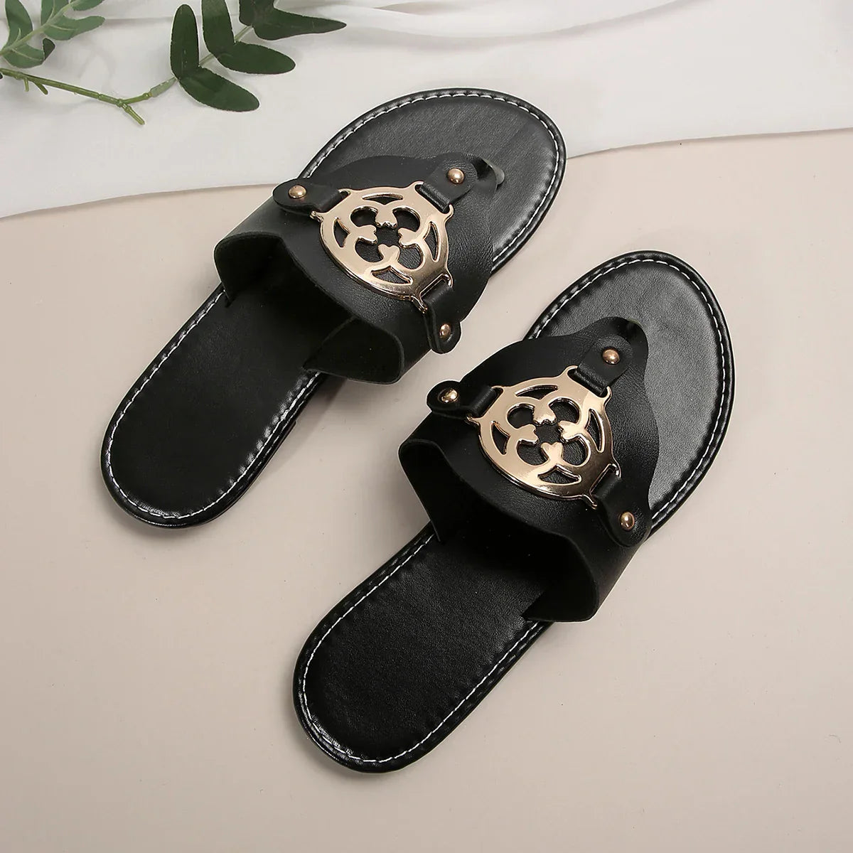 Women's open-toe flat sandals in neutral tone with breathable open silhouette for all-day summer comfort