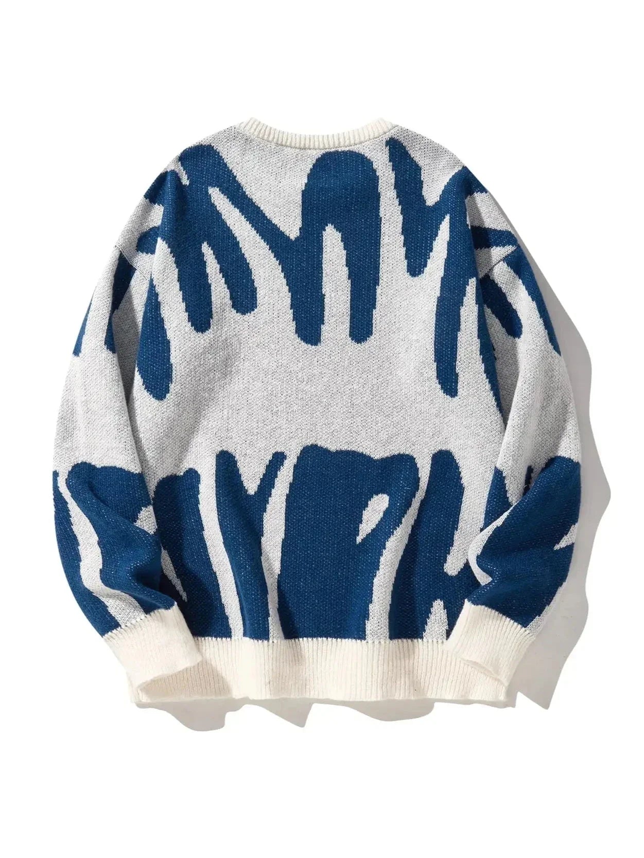Women's oversized abstract knit pullover in bold multicolor pattern, lightweight warm sweater with artistic design