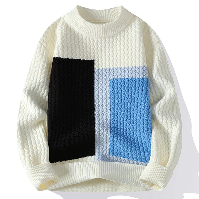 Geometric colorblock knit sweater with sculpted textured panels in bold unisex modern style
