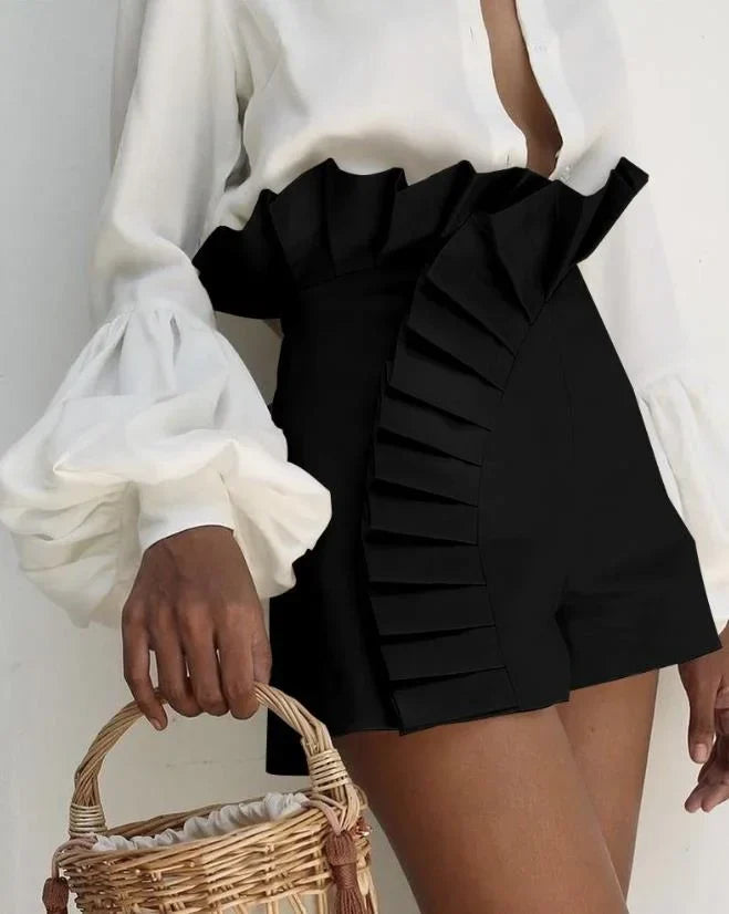Women's pleated high-waist shorts with cascading ruffles, flattering silhouette for warm-weather style