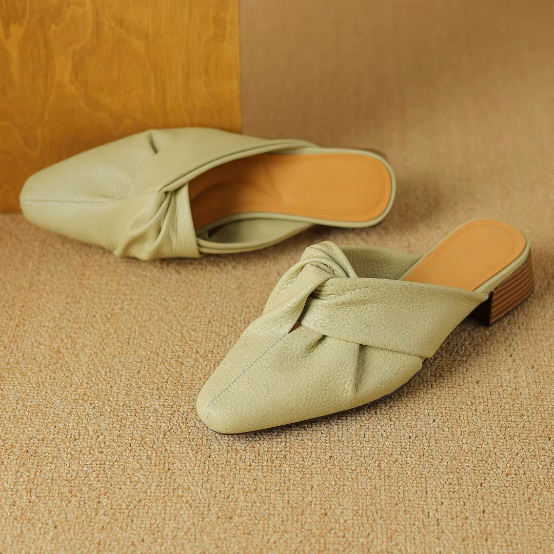 Women's genuine leather mules with bow-knot detail, textured finish, slip-on style, modern elegant design