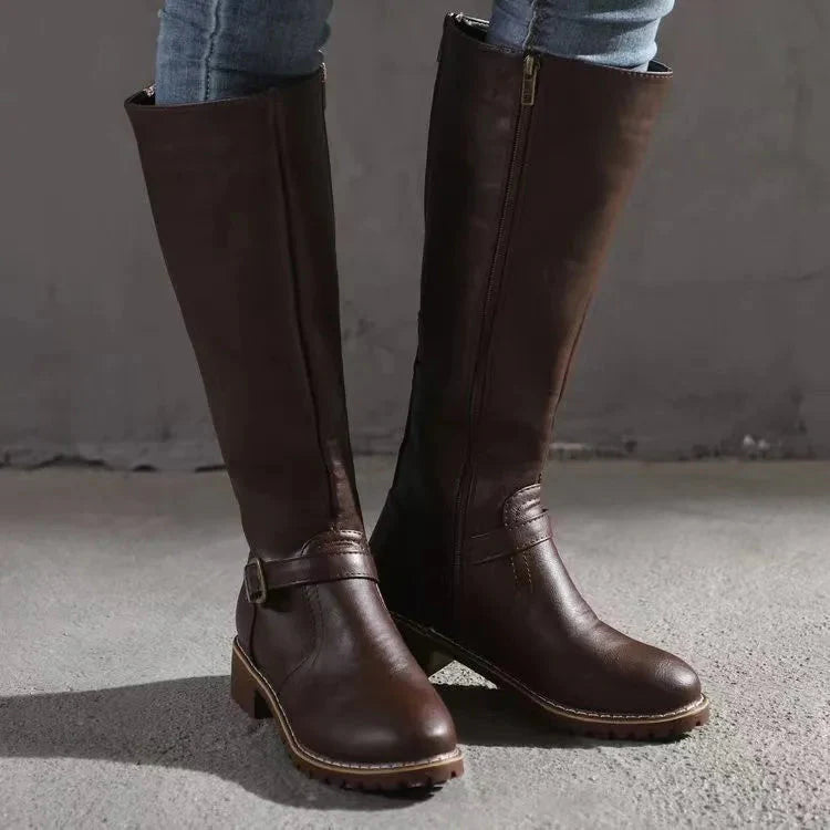 Women's black knee-high boots with elegant buckle detail, all-day comfort and stylish modern support