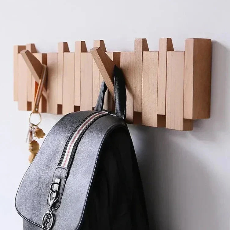 Wall-mounted minimalist wooden coat rack in warm walnut FSC-certified solid wood with natural wax finish