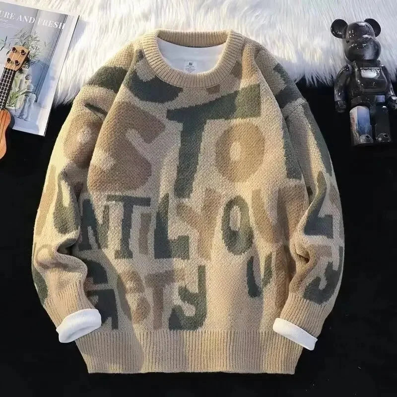 Oversized knit sweater abstract letter pattern muted tones streetwear cozy layering essential