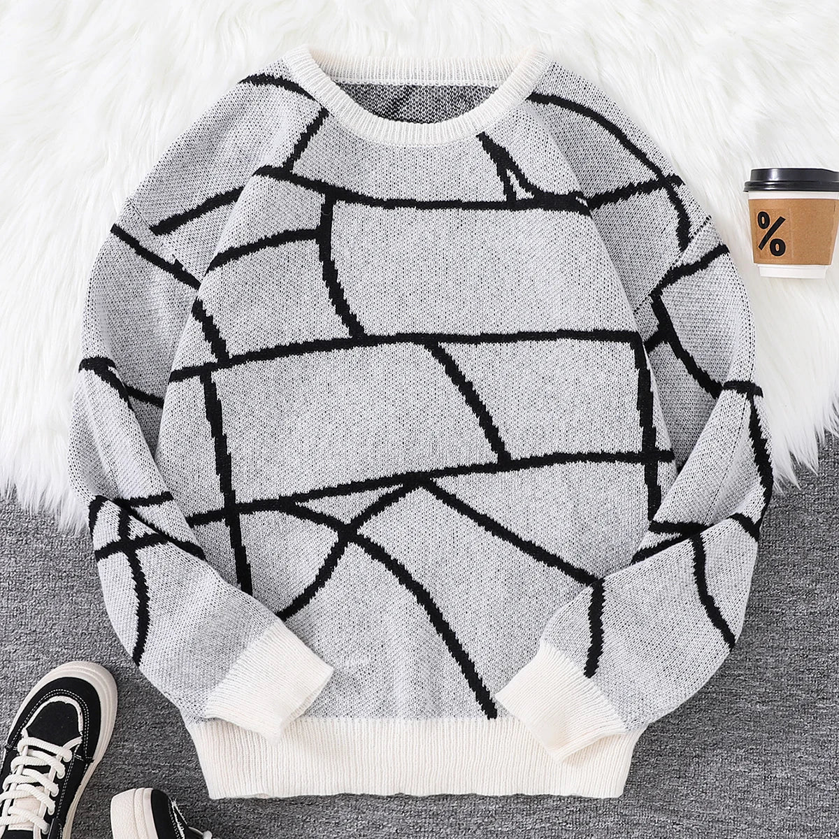 Unisex black and white geometric pattern sweater, relaxed fit with bold abstract urban motif