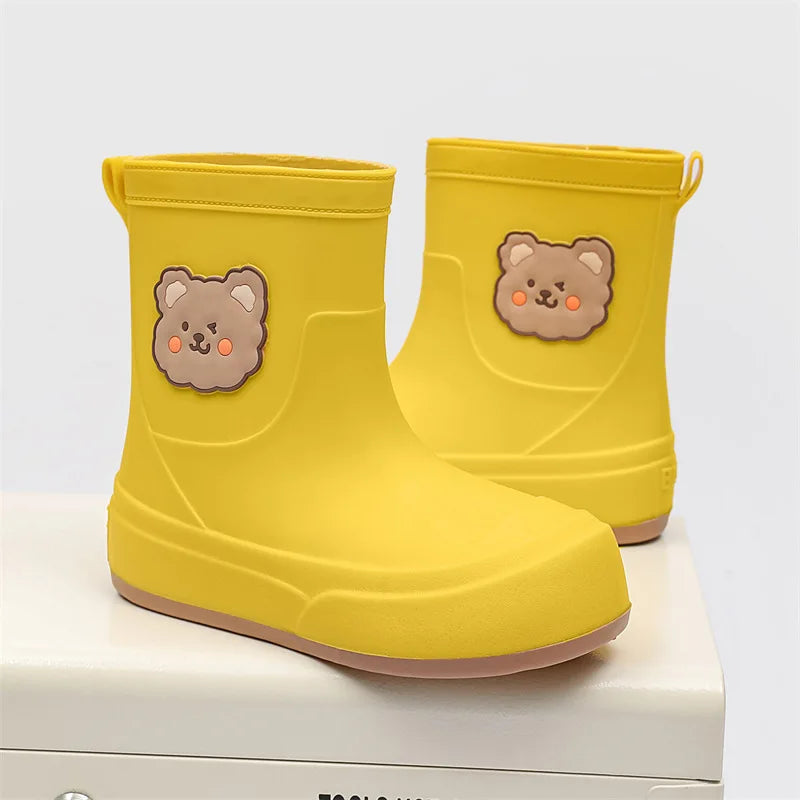 Women's ankle-height waterproof rubber rain boots in neutral tone with whimsical bear motif pull-on design