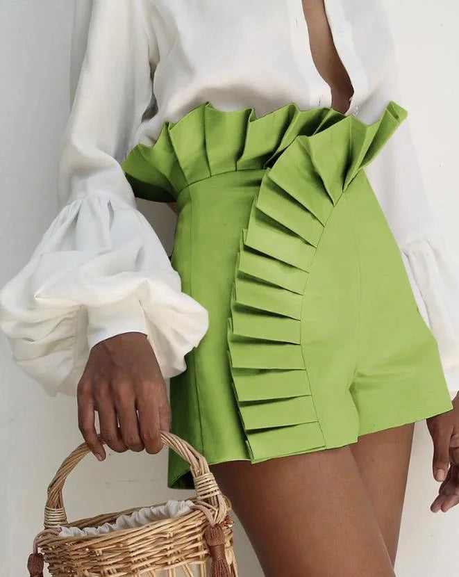 Women's pleated high-waist shorts with cascading ruffles, flattering silhouette for warm weather