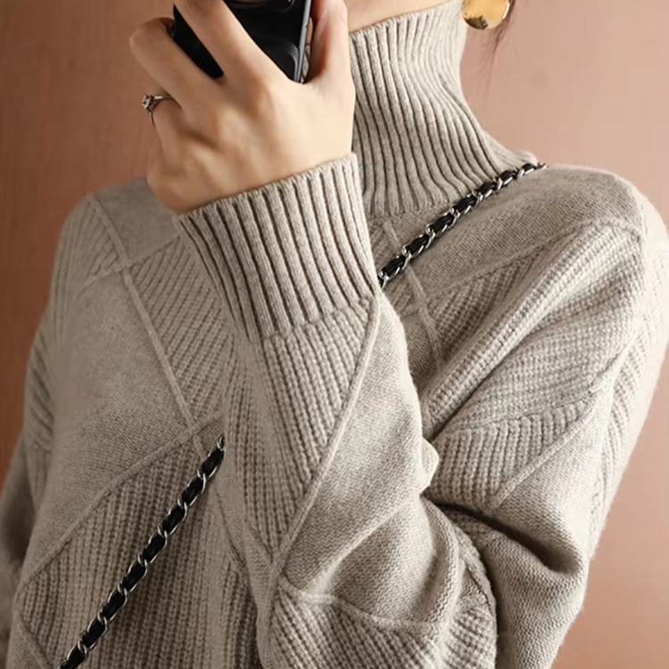 Women's oversized turtleneck knit sweater in cozy soft acrylic blend with relaxed pullover silhouette