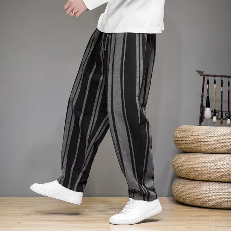 Men's vintage jogger pants with side stripe tapered harem silhouette for streetwear comfort
