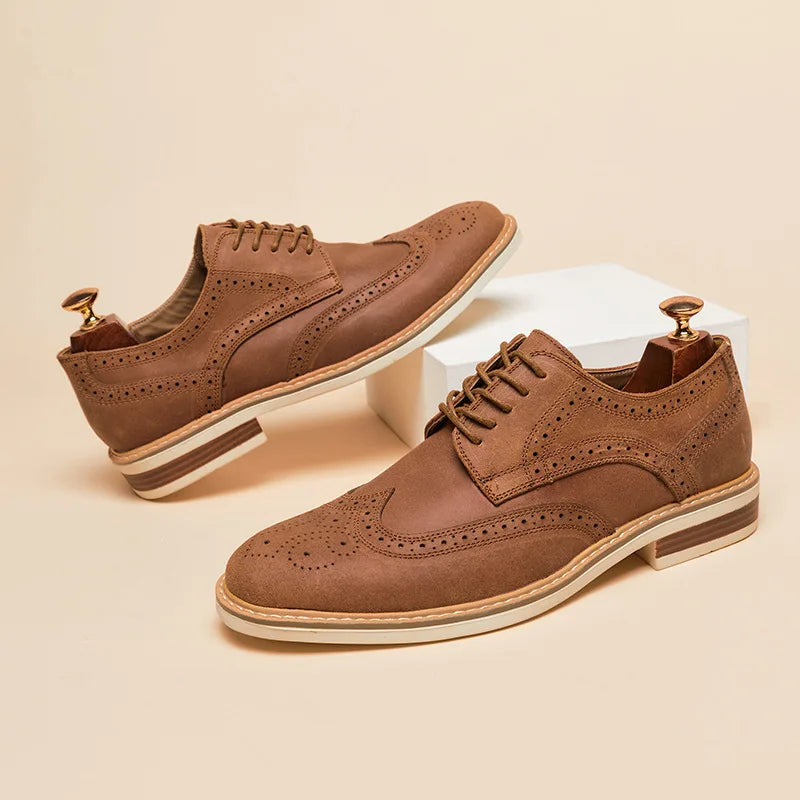 Men's brown suede wingtip Oxford shoes with double-stitch construction and slip-resistant sole