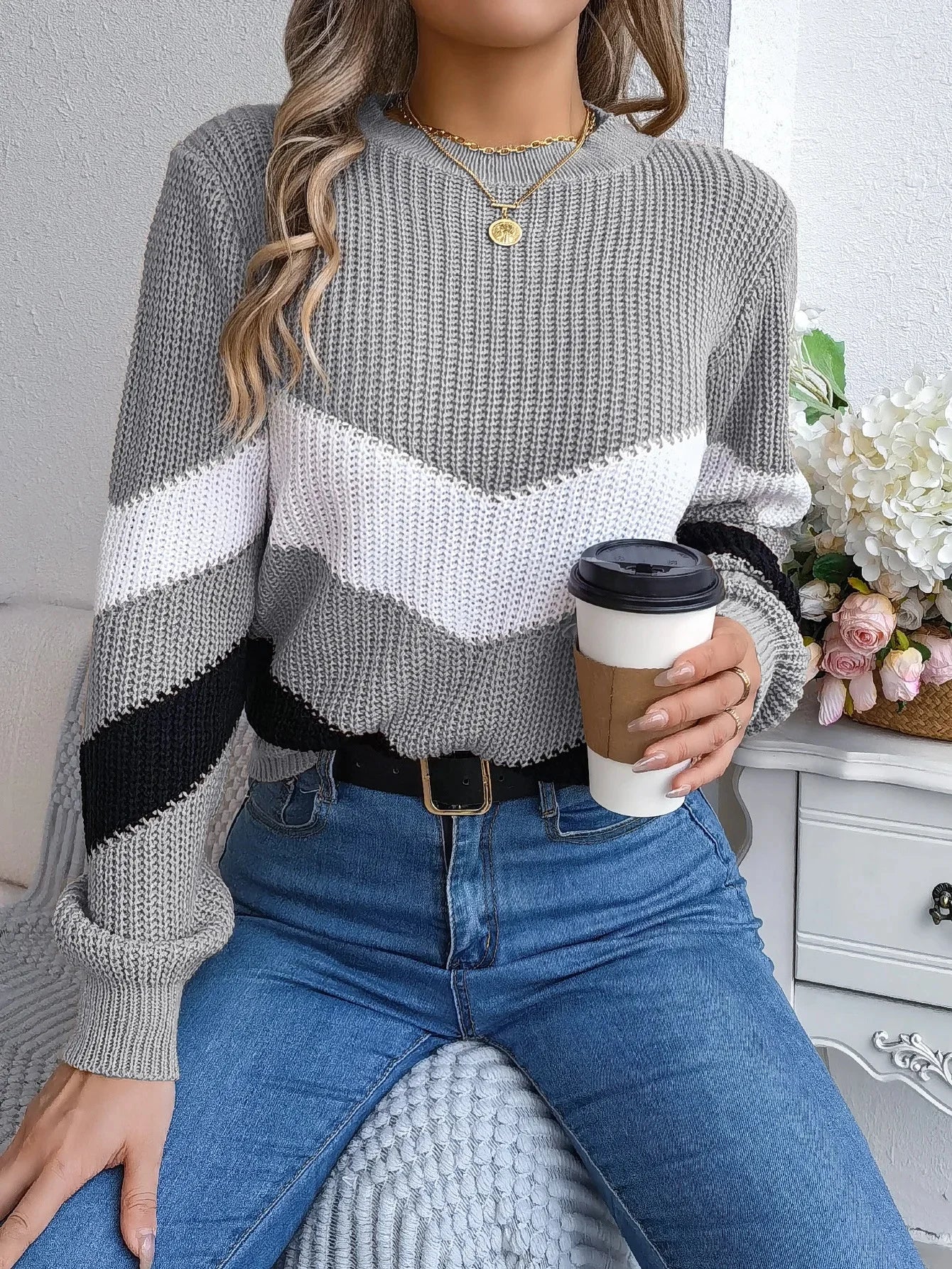 Women's cashmere turtleneck sweater with bold chevron color-block pattern, relaxed fit for cozy winter warmth