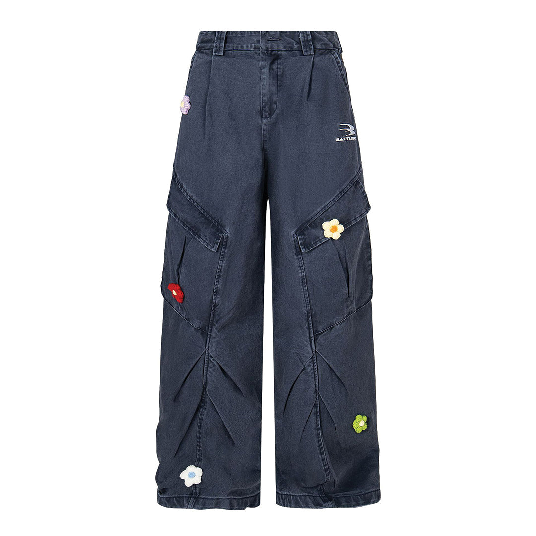 Blue loose-fit denim cargo trousers with knit flower accents for casual streetwear styling