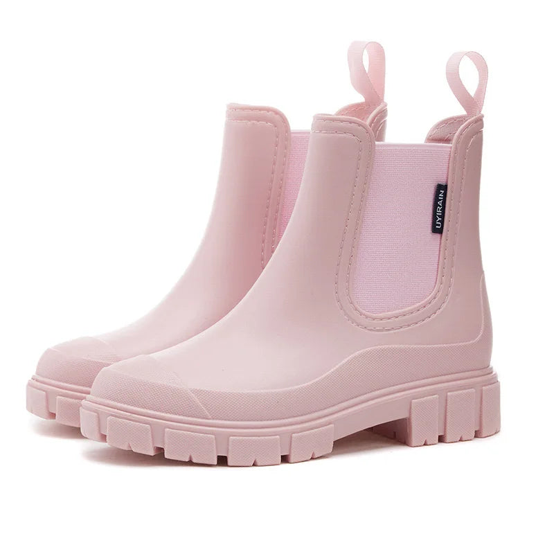 Women's black waterproof Chelsea rain boots with elastic side panels for all-day everyday style