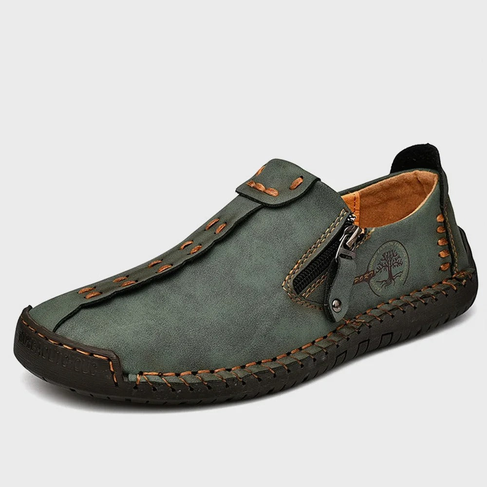Black slip-on leather shoes with side zipper, handcrafted stitching, street-ready urban style