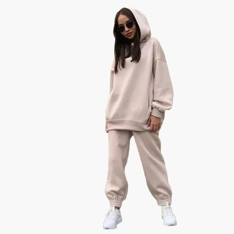 Women's oversized hoodie jogger set in casual street style with matching two-piece loose fit silhouette