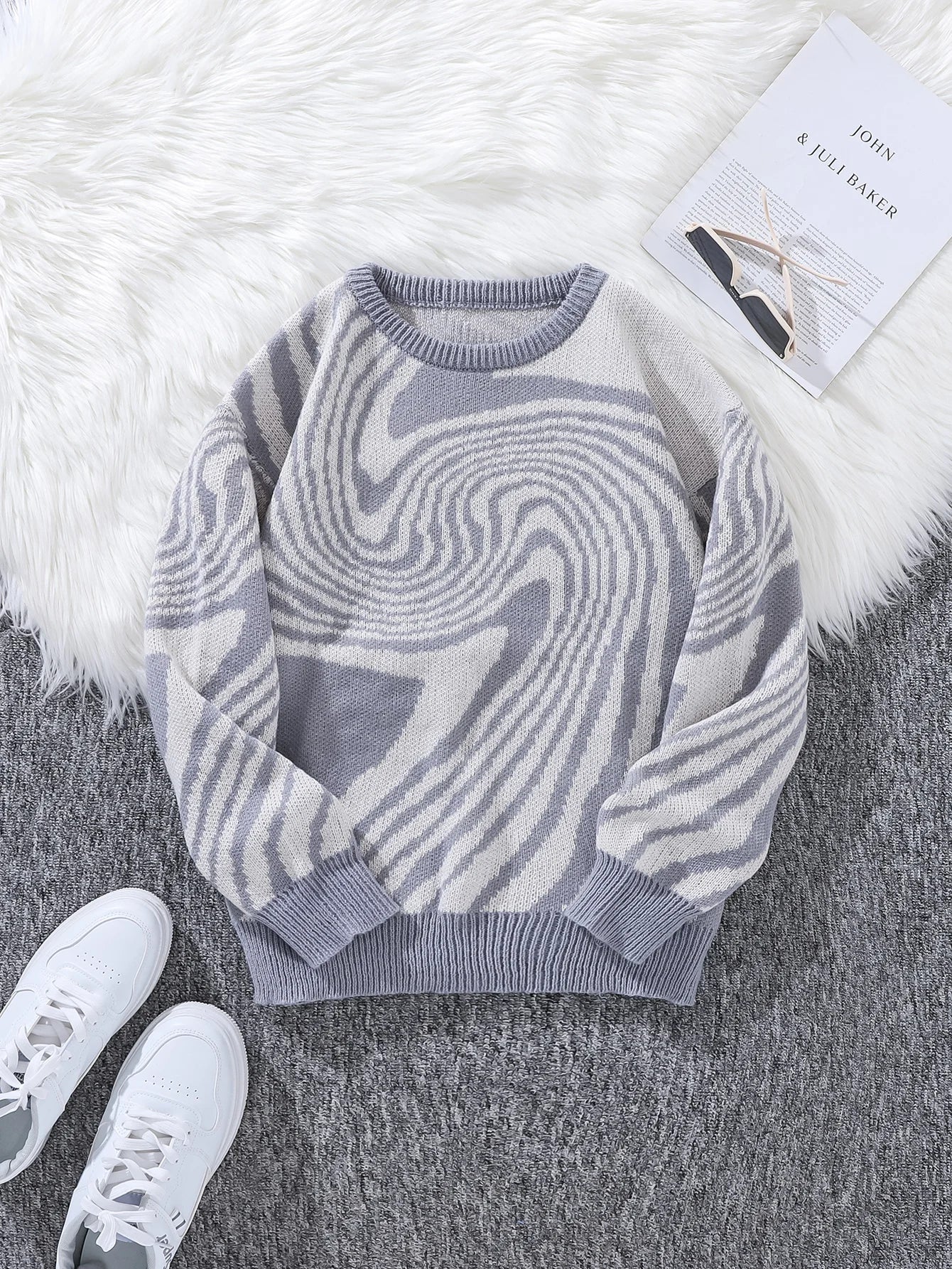 Men's abstract wave pattern knit sweater in contrasted tones, relaxed fit with bold artistic design