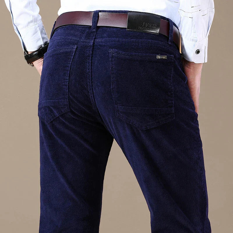 Men's slim-fit elastic corduroy pants in neutral tone with stretch waistband for versatile wear