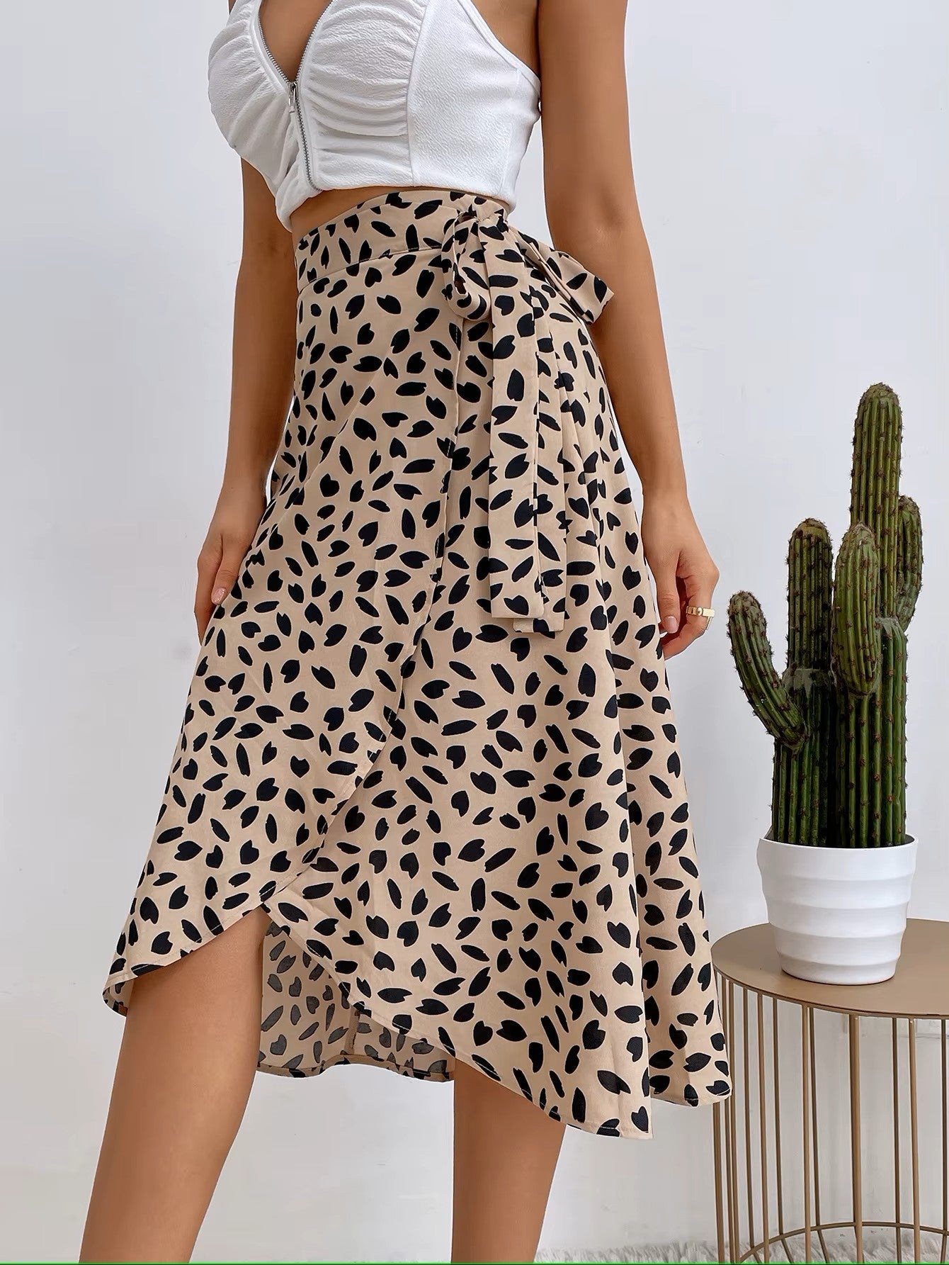 Flowy cotton midi wrap skirt bold speckled print cinched waist curve-skimming silhouette