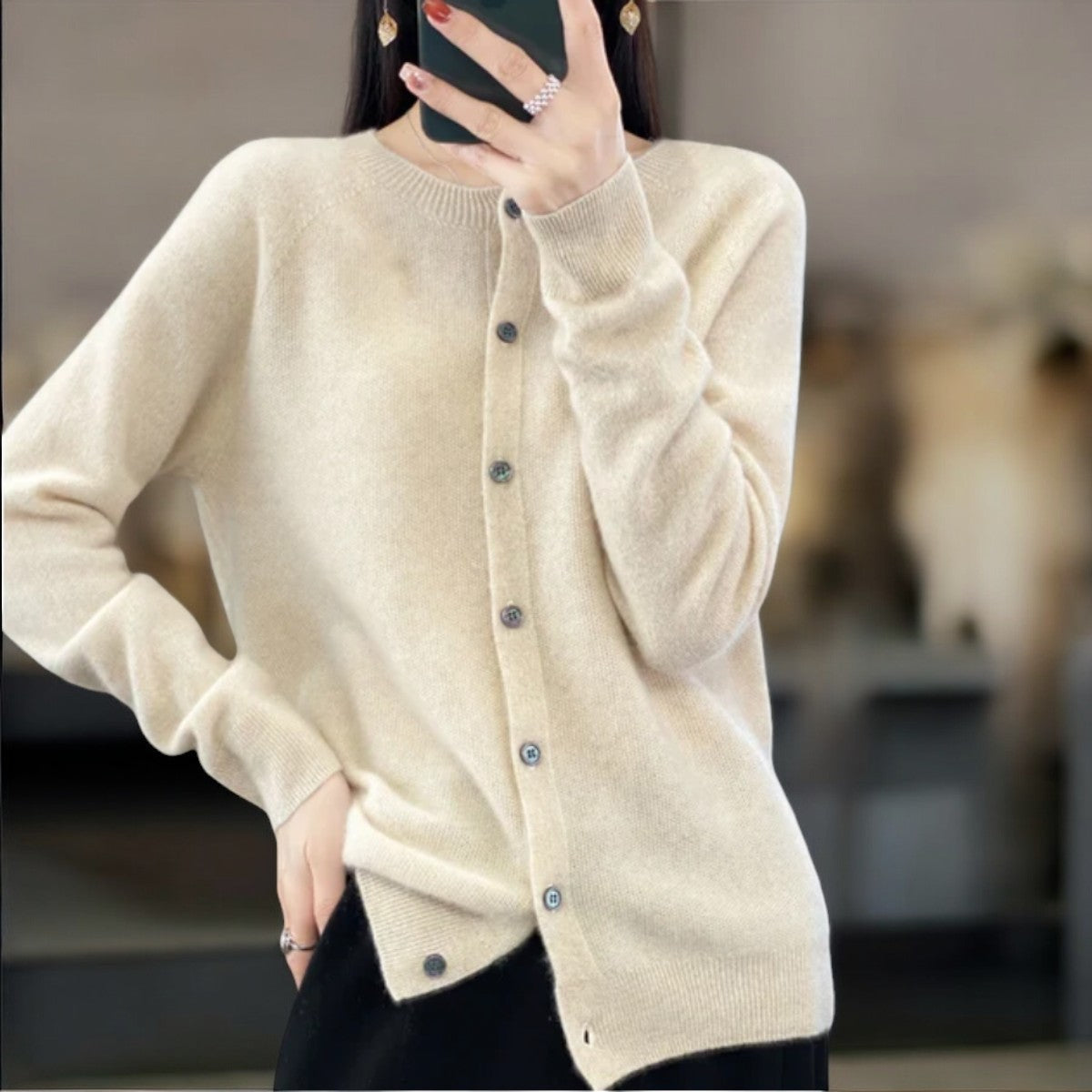 Women's merino wool cardigan in neutral tone, relaxed elegant fit with single-button closure