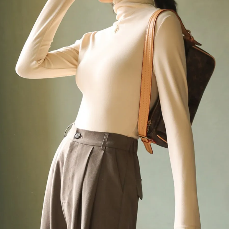 Women's velvet turtleneck sweater with elegant lacy collar, cozy luxurious fit, wardrobe essential