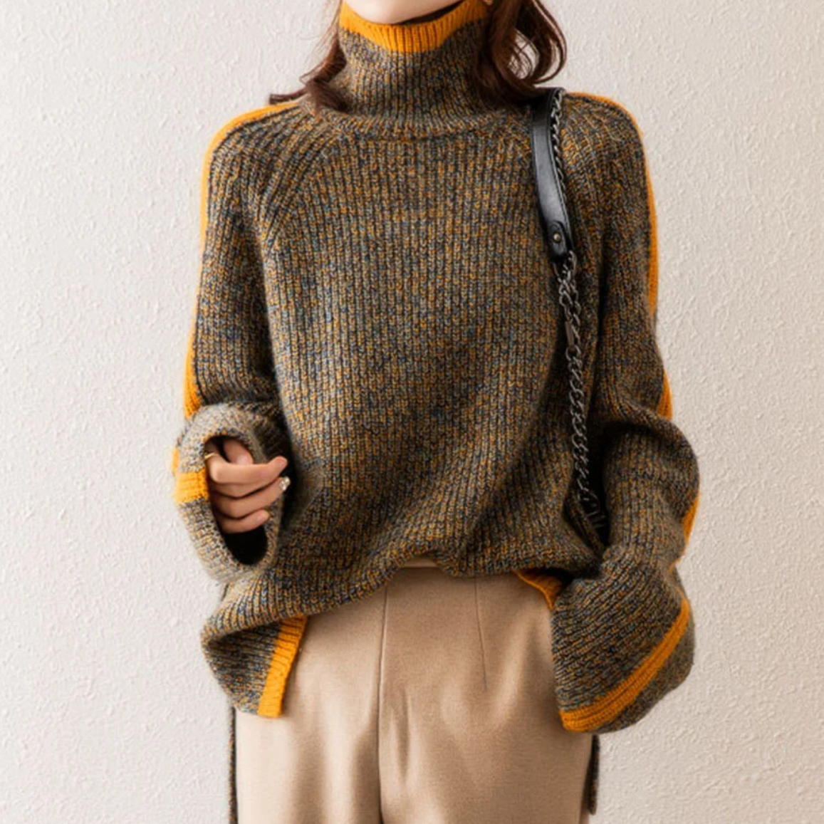 Women's cozy knit sweater in neutral tone, modern relaxed fit with flattering silhouette for winter wear