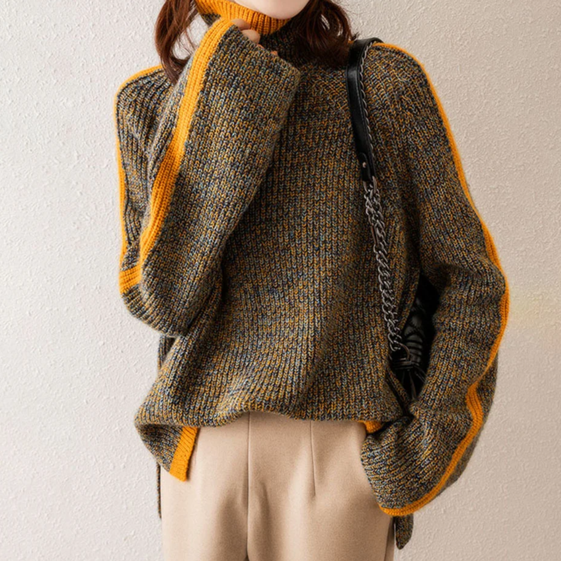 Women's oversized soft knit turtleneck sweater in cozy relaxed fit with chunky ribbed neckline