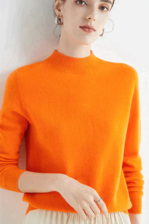Warm women's long-sleeve knit sweater in cozy luxury fabric with flattering silhouette for winter