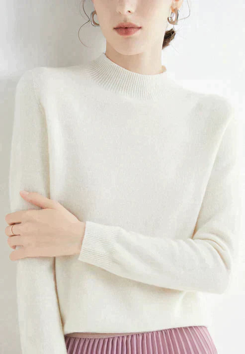 Women's cozy knit long-sleeve sweater in warm tones, luxurious soft fabric with flattering everyday silhouette