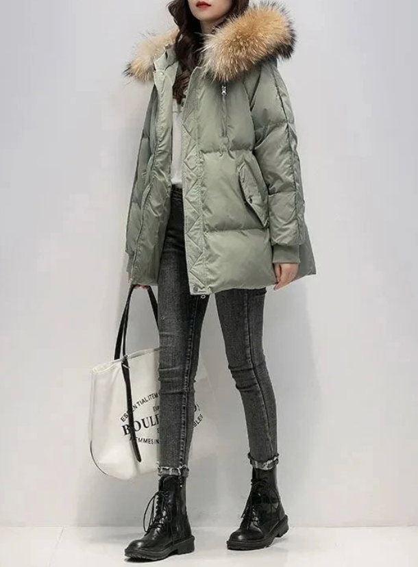 Women's winter coat with faux fur hood trim, structured silhouette, sleek non-bulky cold-weather outerwear