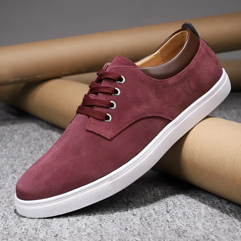 Men's white lace-up court sneakers with metallic eyelets, clean contemporary design for everyday wear