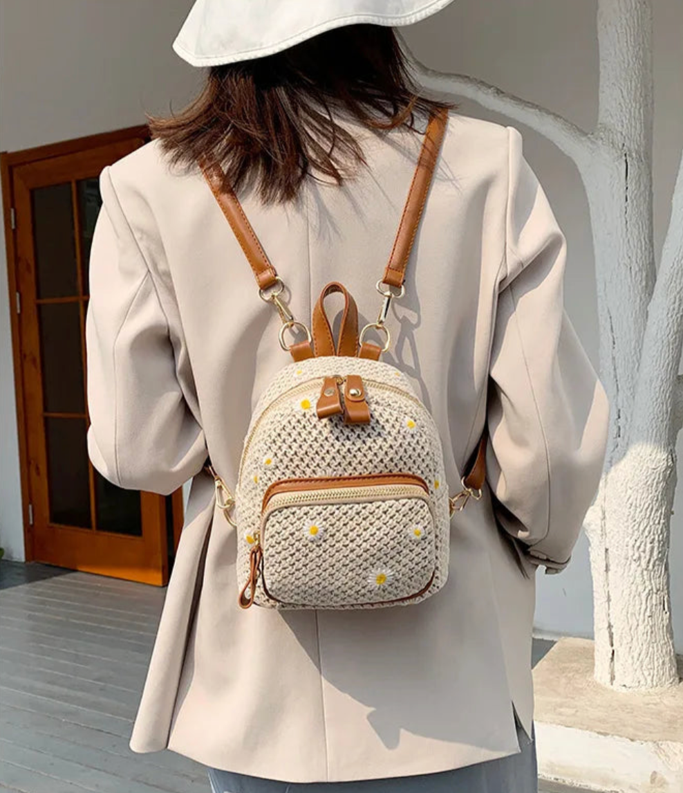 Lightweight handwoven straw backpack with daisy floral embroidery, petite bohemian style for campus