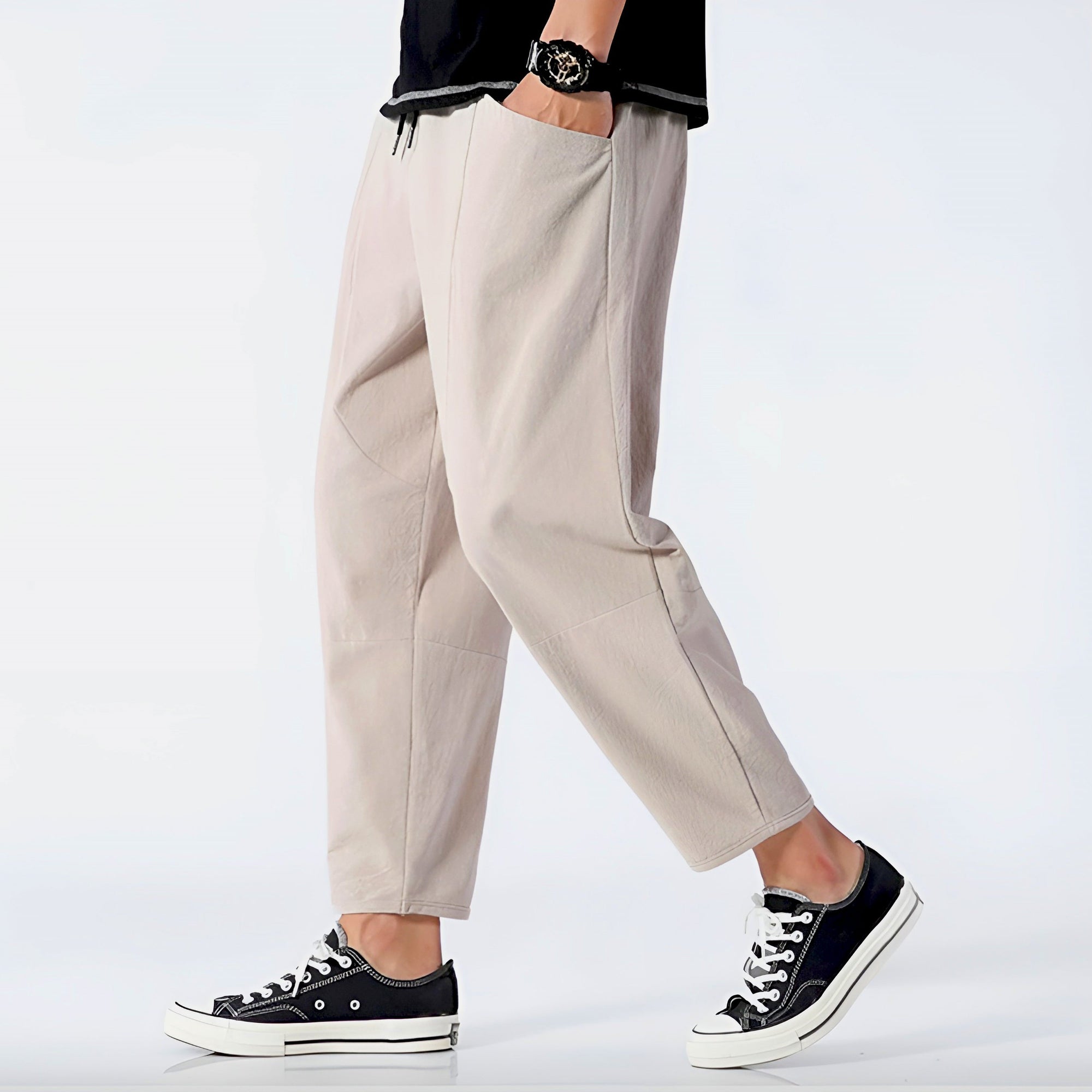 Beige cropped relaxed-fit linen blend pants with adjustable drawstring waist for urban everyday wear