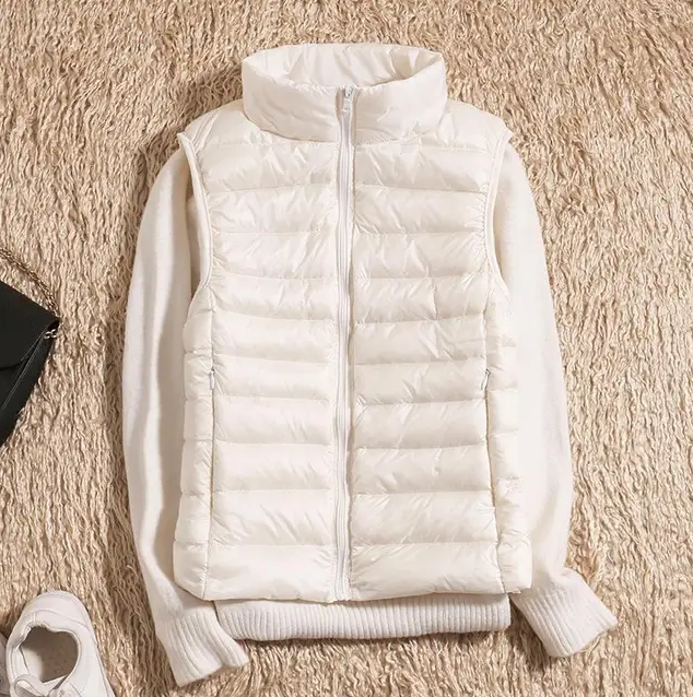 Women's ultralight packable down jacket in neutral tone, slim fit with sustainable insulation