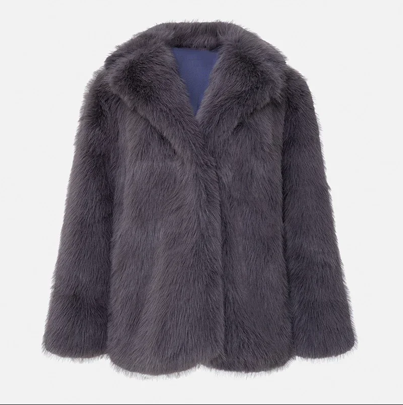 Women's plush faux fur luxury jacket in neutral tone, polished silhouette for chic winter warmth