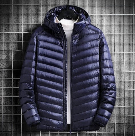 Alpine Crest lightweight down jacket in neutral tones, sleek outdoor puffer silhouette with premium insulation