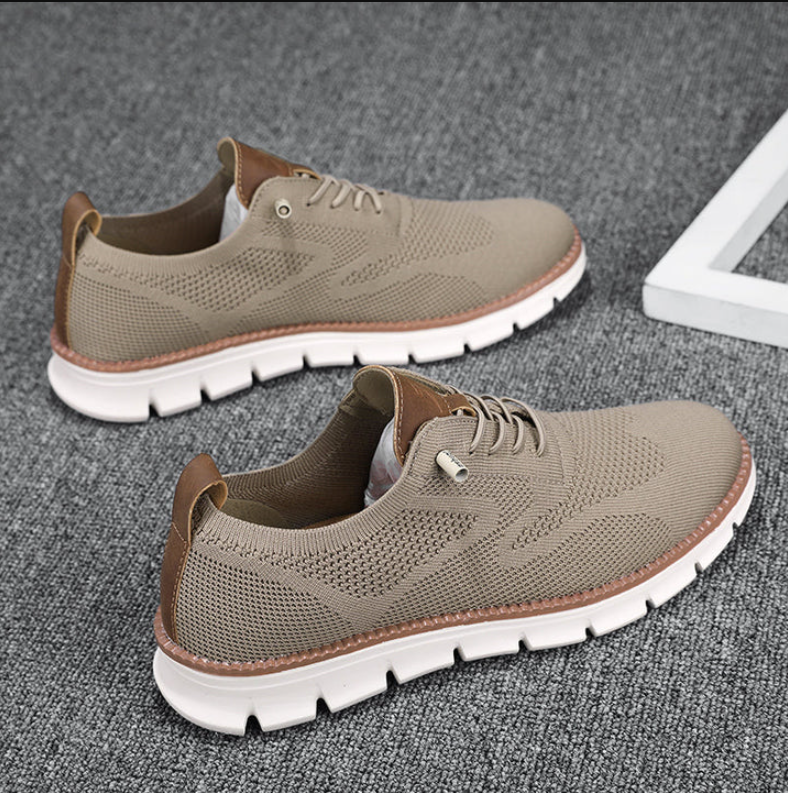 White lace-up running shoes with sleek athletic silhouette and cushioned sole for active everyday wear