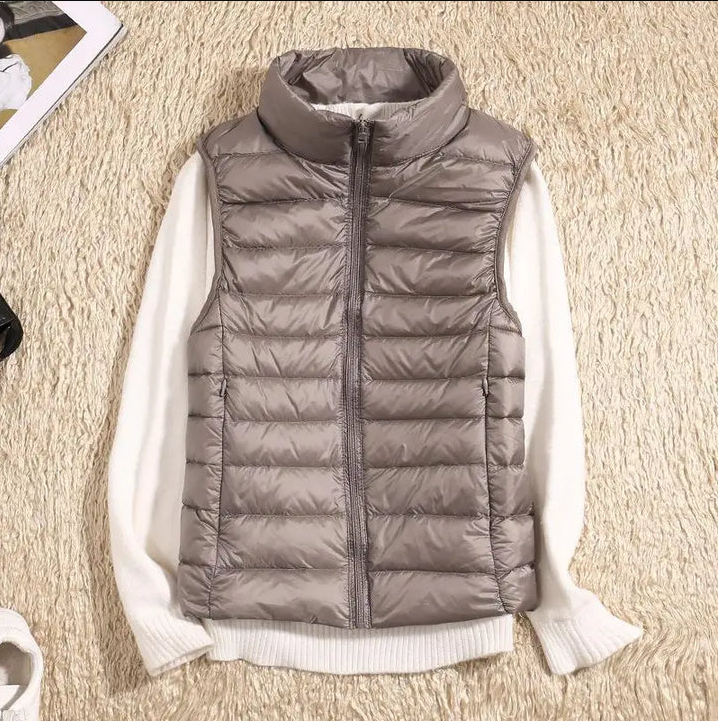 Women's ultralight packable down jacket in sleek design, lightweight cold-weather insulation, sustainable comfort
