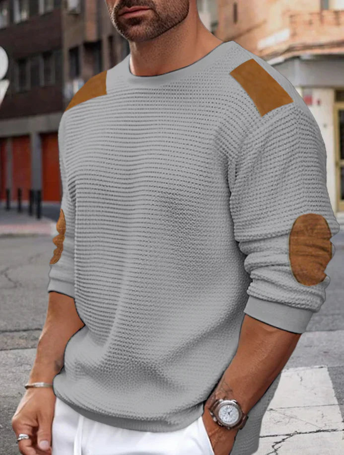Men's beige waffle knit jumper with relaxed fit and distinctive textured ribbed pattern for cozy warmth