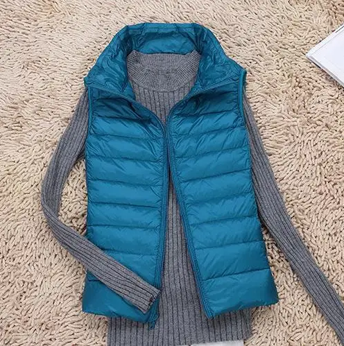 Women's ultralight packable down jacket in sleek design, sustainable insulation for cold weather