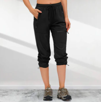 Women's olive green lightweight cargo hiking pants with zippered pockets, quick-dry trail-ready fit