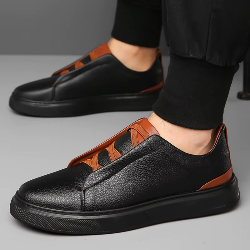 Men's white leather slip-on low-top sneakers with contrast accent detailing for casual style